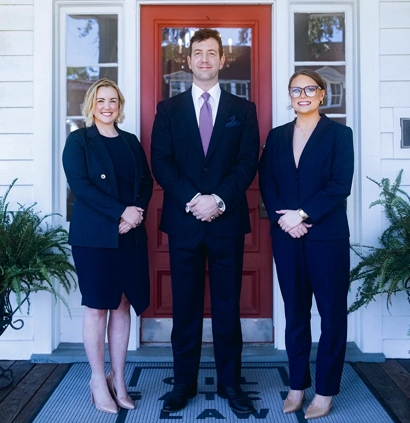 Gil Gatch is standing confidently with his team members